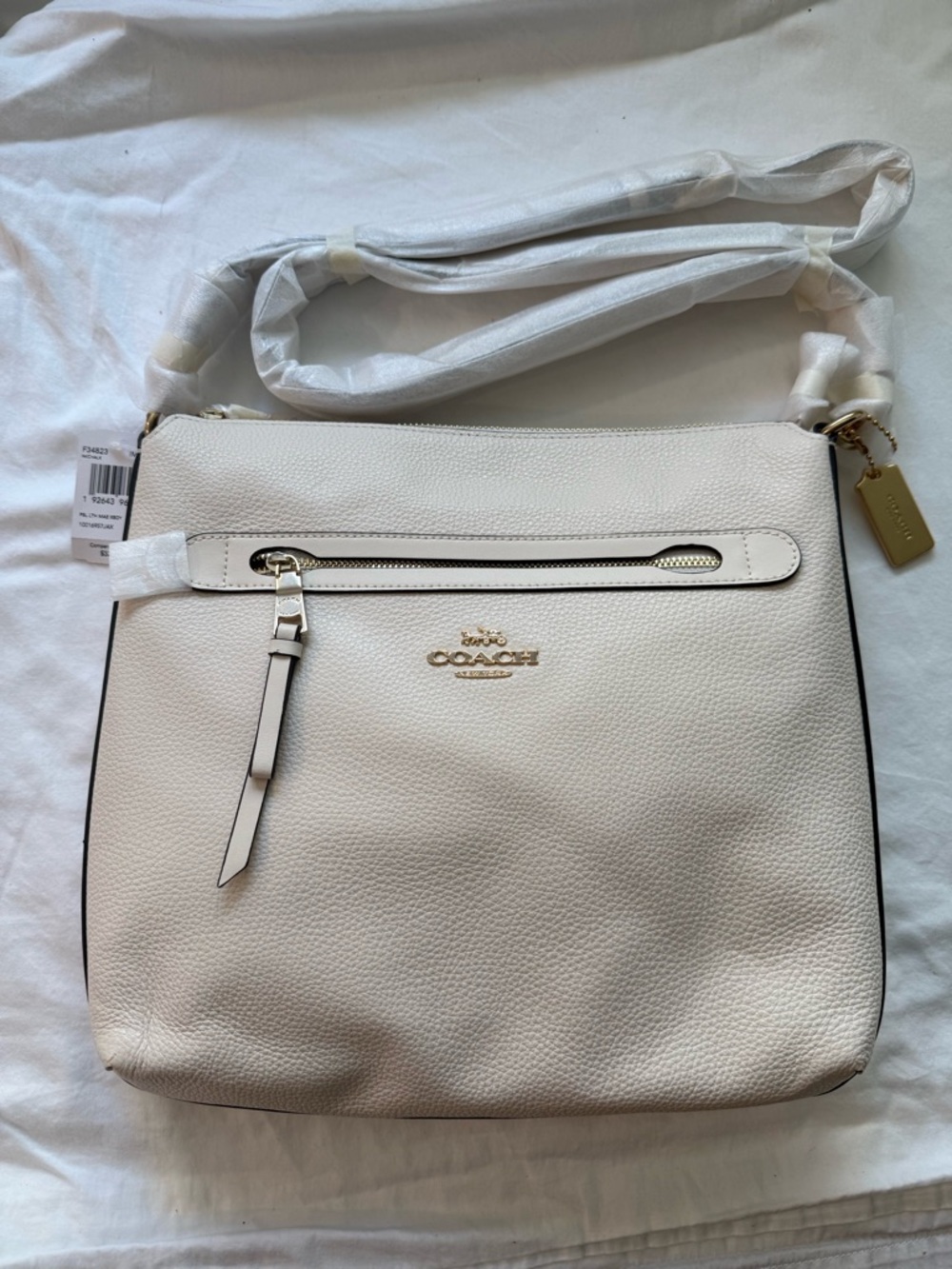 Coach Pebbled Leather Crossbody Bag in Cream color